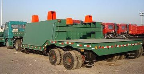 Полуприцеп QDT9700TGZB предназначен для перемещение ковша